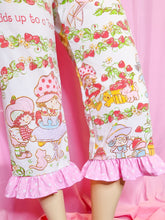 Load image into Gallery viewer, Capri pants with cartoon characters and strawberry pattern with pink polka dot ruffles on a pink background