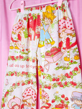 Load image into Gallery viewer, Elastic waisted pants with strawberry shortcake design on a pink background