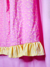 Load image into Gallery viewer, Pink fabric with yellow pop tart pattern and ruffled yellow gingham edge on a pink background