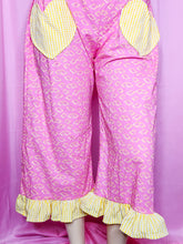 Load image into Gallery viewer, Pink pants with yellow pop tart pattern with yellow gingham heart shaped pockets on a mannequin against a pink background