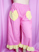 Load image into Gallery viewer, Pink pants with yellow pop tart pastries on a pink background