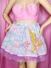 Load image into Gallery viewer, Pink top and colorful skirt with She-Ra and Swift Wind design on a pink background