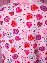 Load image into Gallery viewer, Pink fabric with heart and cake pattern on a pink background