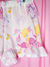 Load image into Gallery viewer, Ruffle shorts with cartoon character design on a pink background
