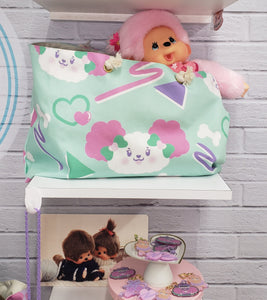 mint green tote bag with dog and bone print, full of plushies and monchhichi