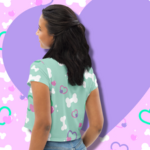 Load image into Gallery viewer, Back view of mint green crop top with bone and heart print on model