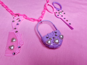 Pink and purple doll things chunky bling maximalist necklace
