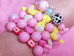 Pink yellow bling heart bow lovecore kandi stretch bracelet