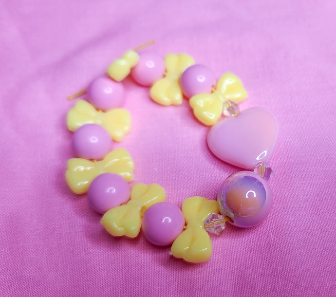Pink yellow bling heart bow lovecore kandi stretch bracelet