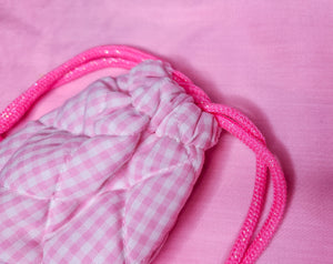 Pink quilted gingham drawstring bag