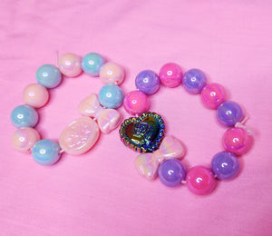 Pink purple rose iridescent bow kandi stretch bracelet