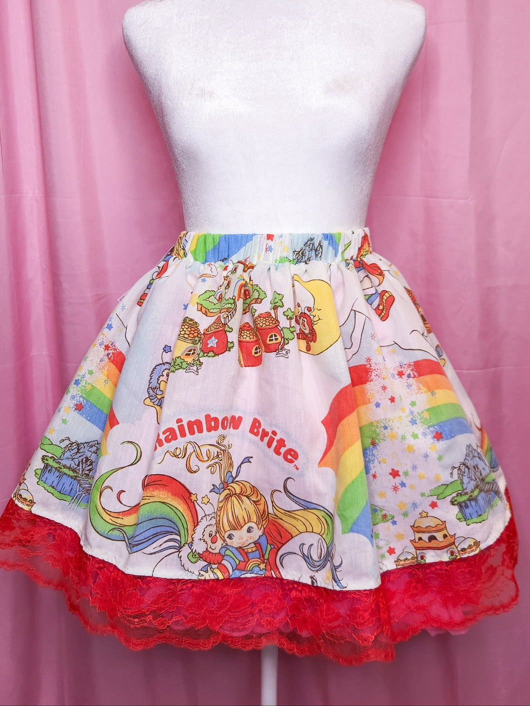 Skirt with Rainbow Brite design on a mannequin against a pink background