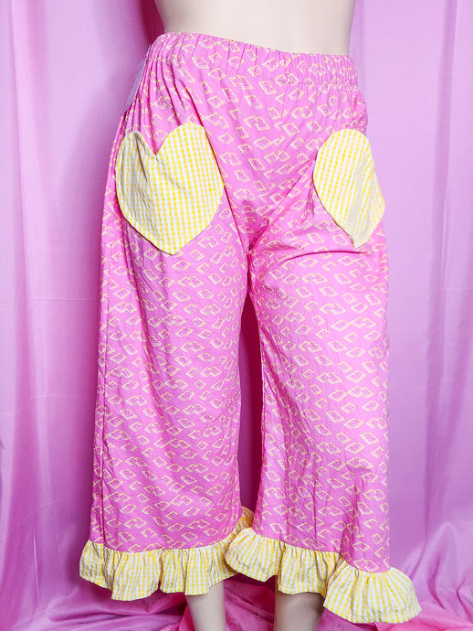 Pink pants with yellow pop tart pastries on a pink background