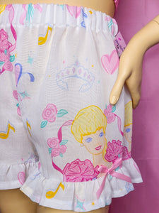 Shorts with a cartoon character design on a pink background