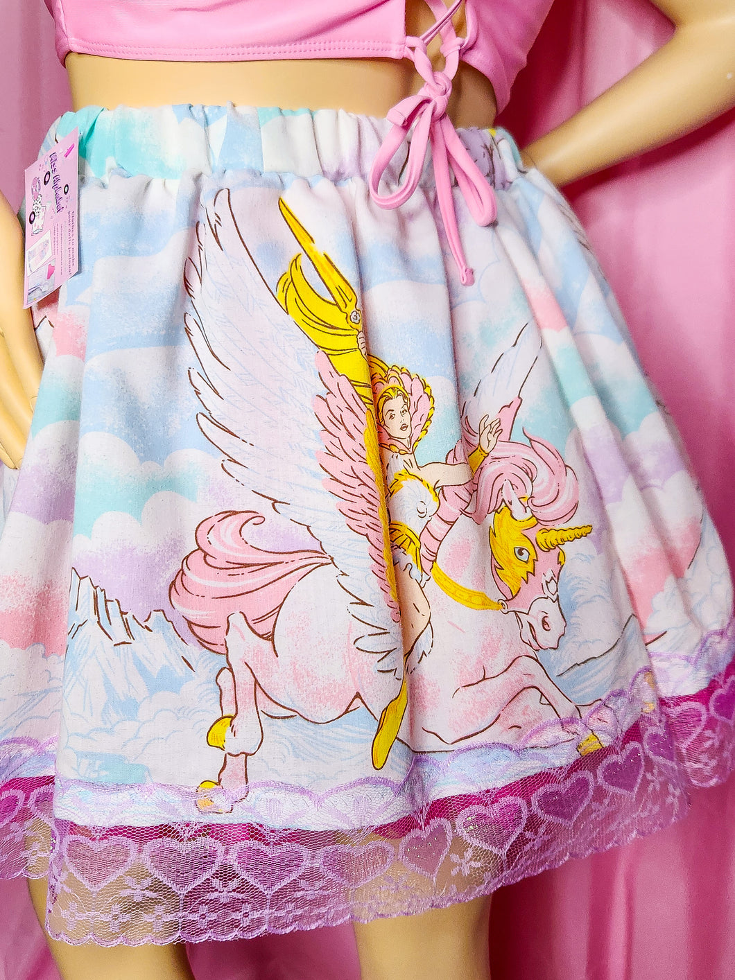 Skirt with she-ra and swift wind design on a pink background