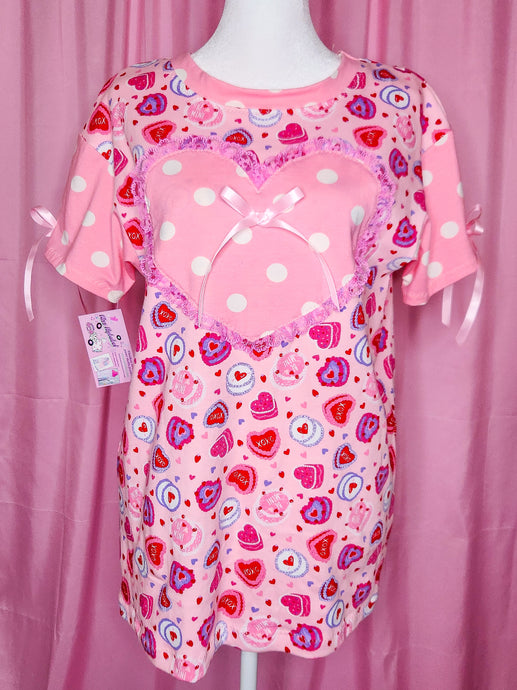 Pink tshirt with heart cake and polka dot pattern on a pink background