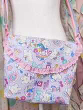 Load image into Gallery viewer, Children's bag with colorful cartoon patterns on a mannequin against a patterned background
