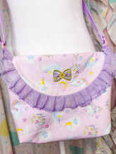 Load image into Gallery viewer, Pastel-colored handbag with decorative elements on a patterned background