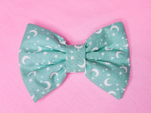 Load image into Gallery viewer, Mint green Halloween stars and moons hair bow, creepy cute witchy goth fashion hair clip