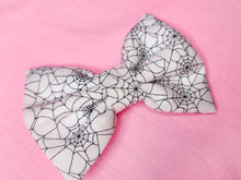 Load image into Gallery viewer, Halloween spider web hair bow, creepy cute witchy goth fashion hair clip