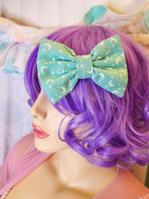 Load image into Gallery viewer, Mint green Halloween stars and moons hair bow, creepy cute witchy goth fashion hair clip