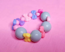 Load image into Gallery viewer, Mint green bubblegum pastel bow stretch Barbiecore kandi bracelet