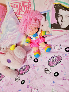 barbie boombox blanket on bed with pillows and stuffed animals