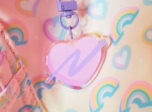 Load image into Gallery viewer, pink swoosh heart keychain with rainbow background
