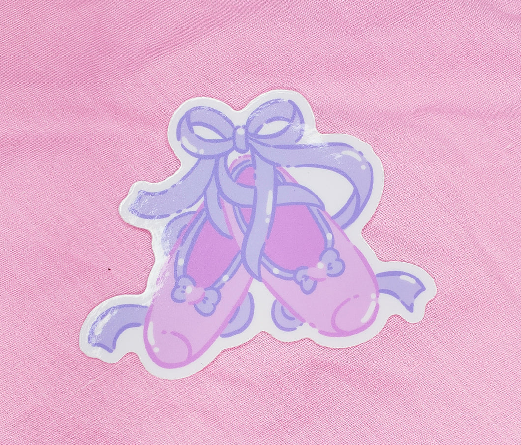shiny sticker featuring a pair of pink and lavender ballet slippers