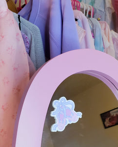 shiny sticker featuring a pair of pink and lavender ballet slippers on a mirror