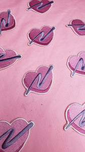 embroidered pink heart patches with purple swoosh