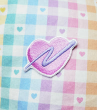Load image into Gallery viewer, embroidered pink heart patch with purple swoosh on a rainbow gingham background