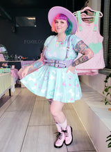 Load image into Gallery viewer, rainbow haired woman posing in a matching mint green crop top and skirt with bone print