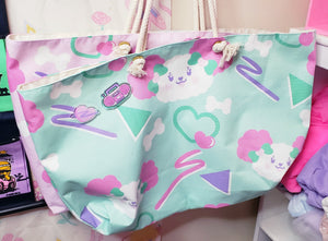 Acrylic pins with pink boombox image and pink swoosh heart on a mint green tote bag with dogs and bones and 90's motifs