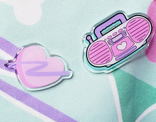 Load image into Gallery viewer, Acrylic pins with pink boombox image and pink swoosh heart on a mint green tote bag with dogs and bones and 90&#39;s motifs