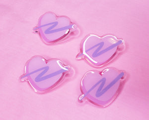 pink heart shaped acrylic pins with lavender swoosh