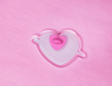 Load image into Gallery viewer, back view of pink heart shaped acrylic pin with lavender swoosh