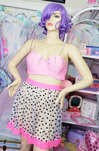 lavender haired mannequin modeling white sheer mesh skirt with black hearts and hot pink waistband and lace