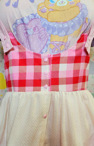 closeup of pink and red gingham yoke of valentine's themed jumperskirt