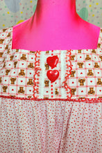 Load image into Gallery viewer, closeup of red heart button detail on red plaid teddy bear yoke of nightie dress