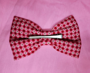 back view of red heart gingham valentine's day hair bow with large alligator clip