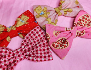 various Valentine's Day lovecore hair bows in pink and red