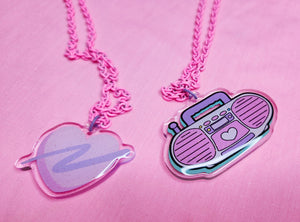 pink enamel chain necklace with pink and lavender glitter swoosh heart acrylic pendant and pink glitter boombox pendant
