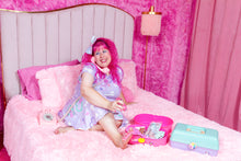 Load image into Gallery viewer, pink haired woman wearing a lavender crop top and skirt set with bone print, sitting in a pink room on a bed giving herself a pedicure
