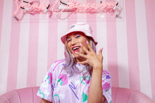 Load image into Gallery viewer, Asian woman modeling a dog print dress and pink bucket hat against a pink and white background
