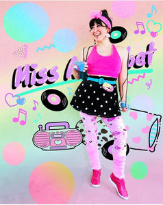 woman modeling leggings with colorful clothing and pink background