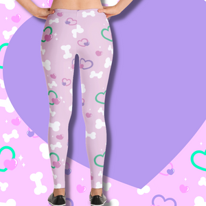 Back view of pink leggings with bone and heart print on model