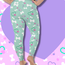Load image into Gallery viewer, Back view of mint green leggings with bone and heart print on plus size model