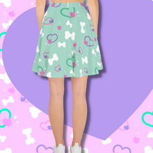 Load image into Gallery viewer, Back view of mint green skater skirt with bone and heart print