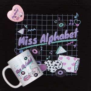 mug and tote bag with pink miss alphabet barbie boombox logo motif